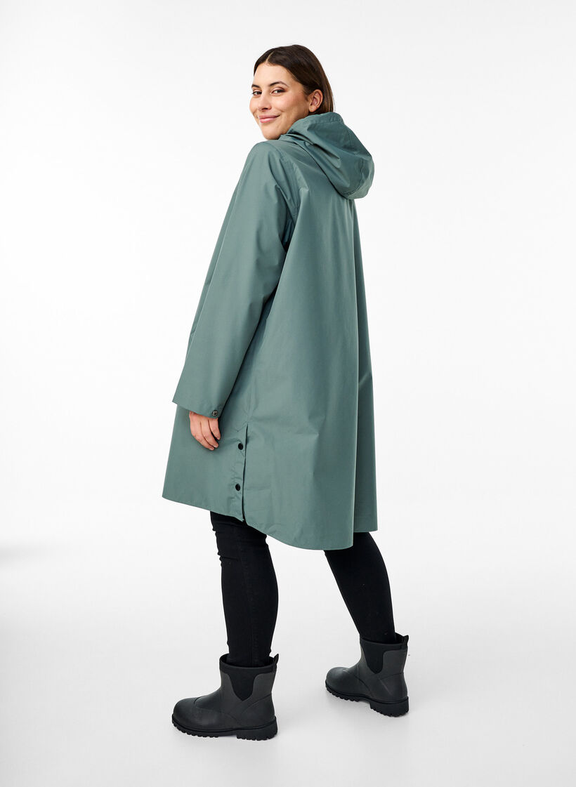 Regenjas met zakken en capuchon, Groen, Model image number 2