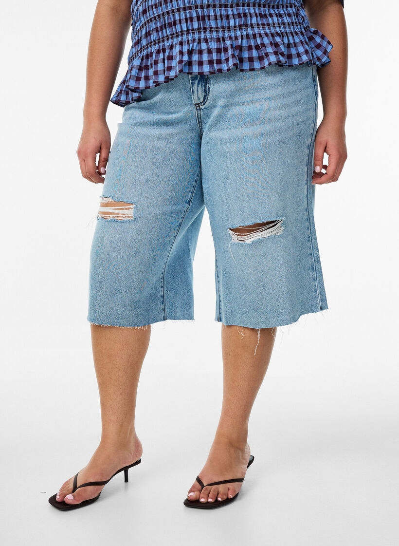 Gecropte jeans met een versleten look en rafelige randen, Blauw, Model