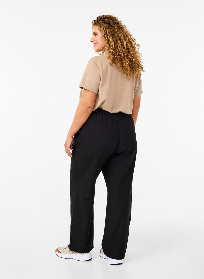 Flared broek met elastiek in de taille, Zwart, Model image number 1