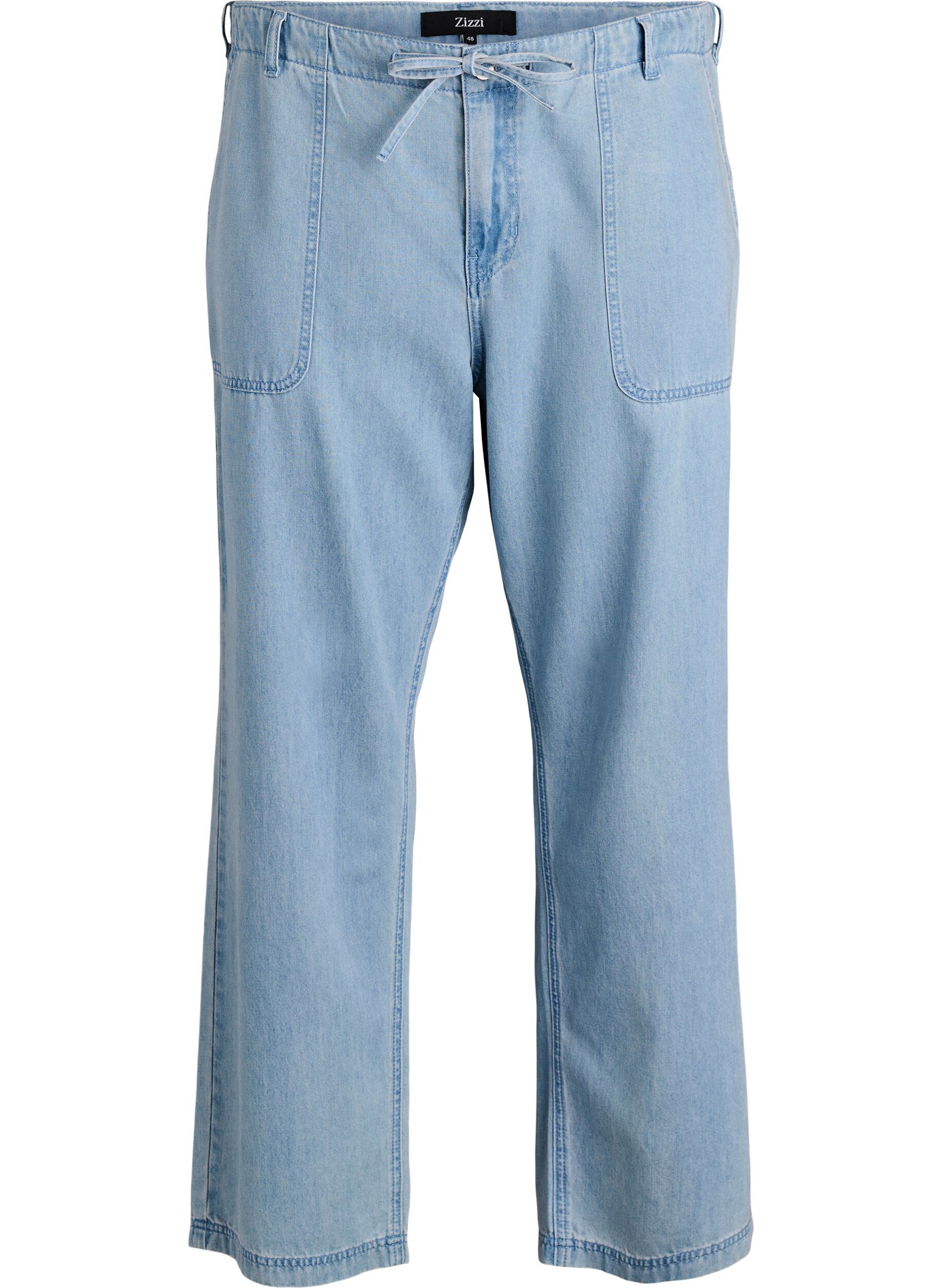 High-waisted jeans met strikceintuur
