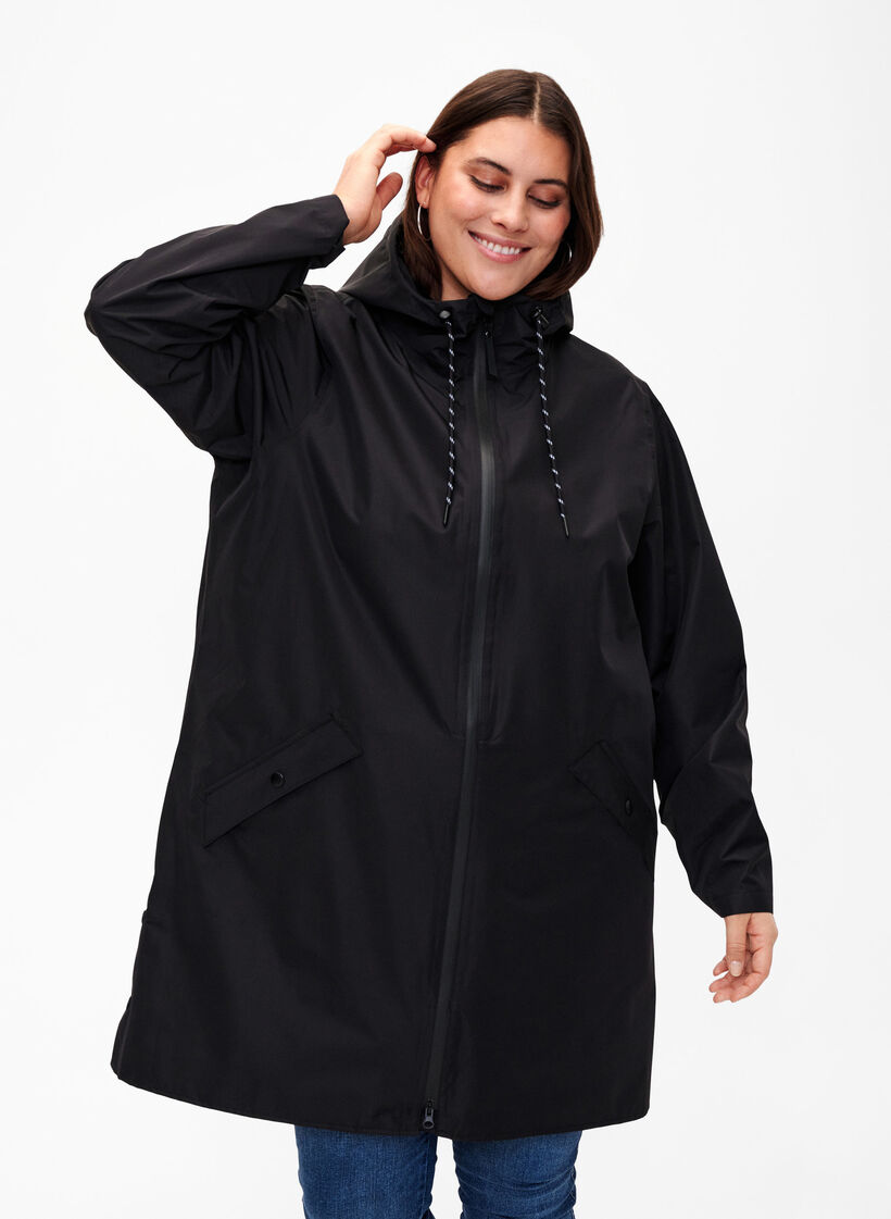 Regenjas met zakken en capuchon, Zwart, Model image number 0