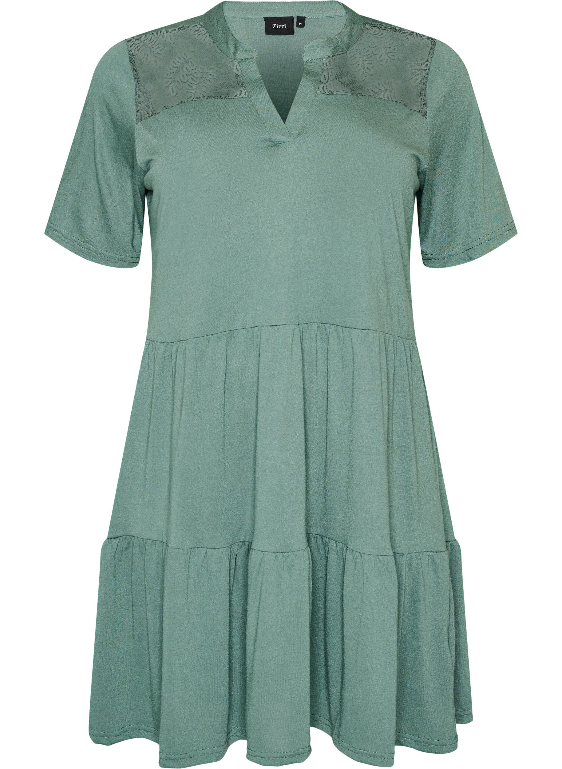 Jerseyjurk met kanten details en een gelaagde rok