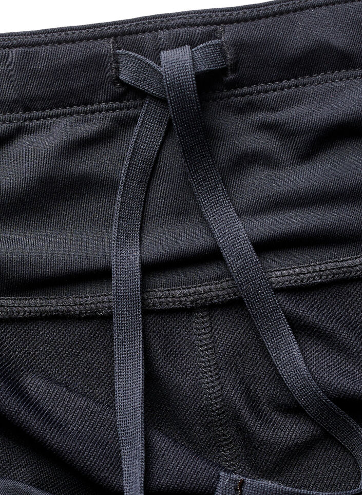 Running tights met lichte compressie en zijzakken, Zwart, Packshot image number 3
