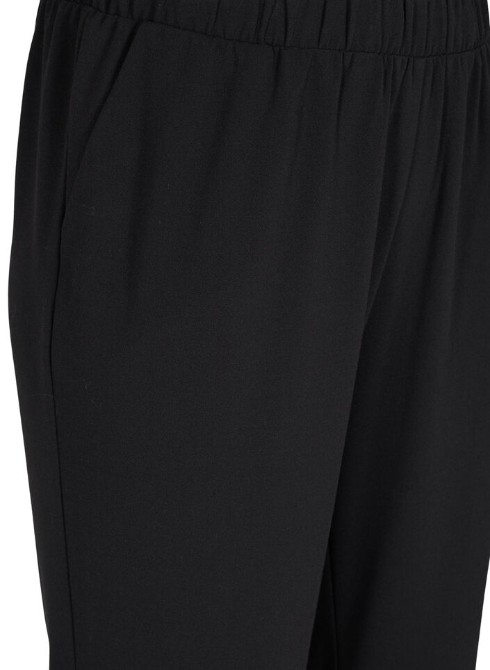 Flared broek met elastiek in de taille, Black, Packshot