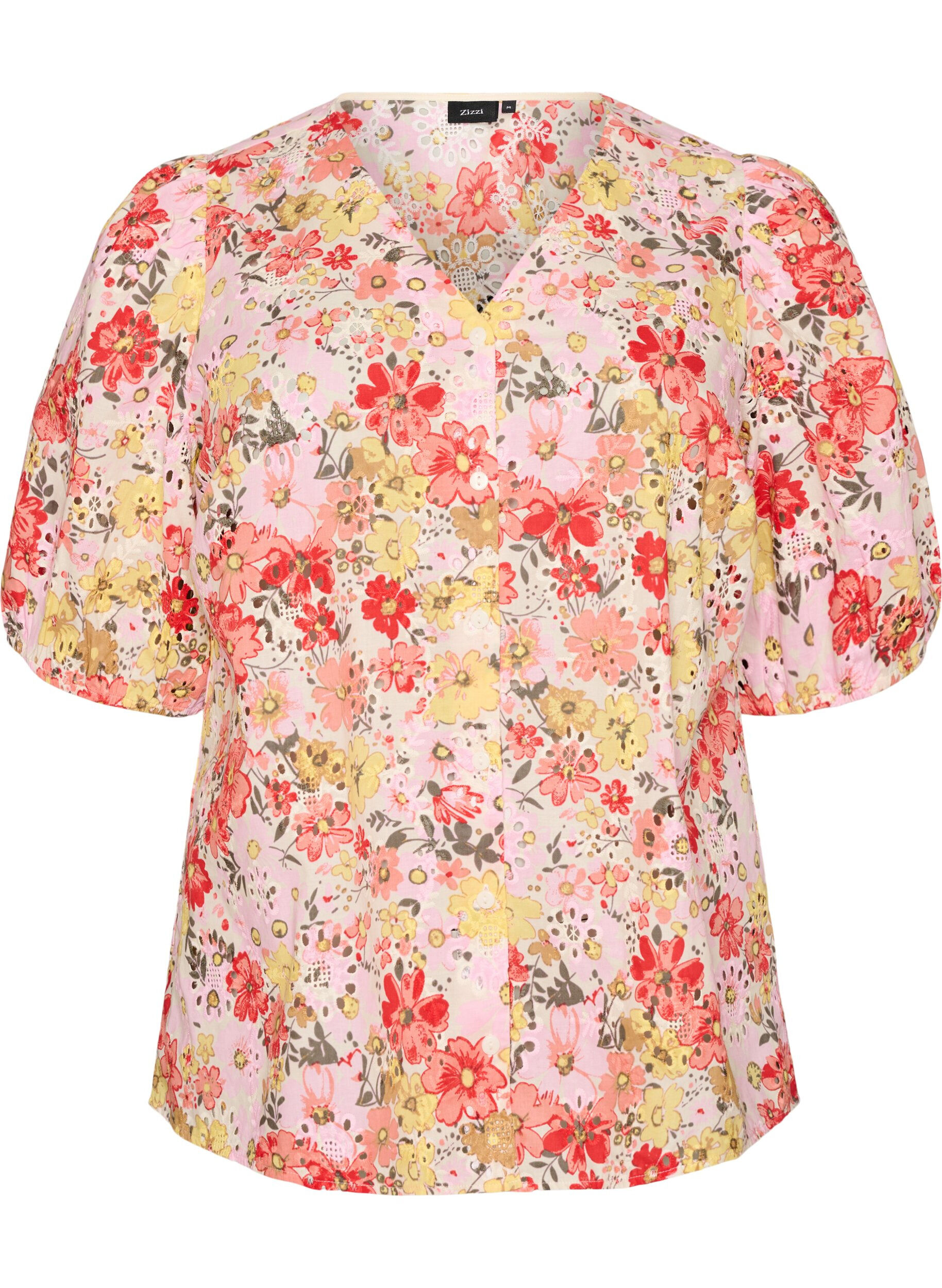 Bloemenblouse met broderiegatwerk en V-hals