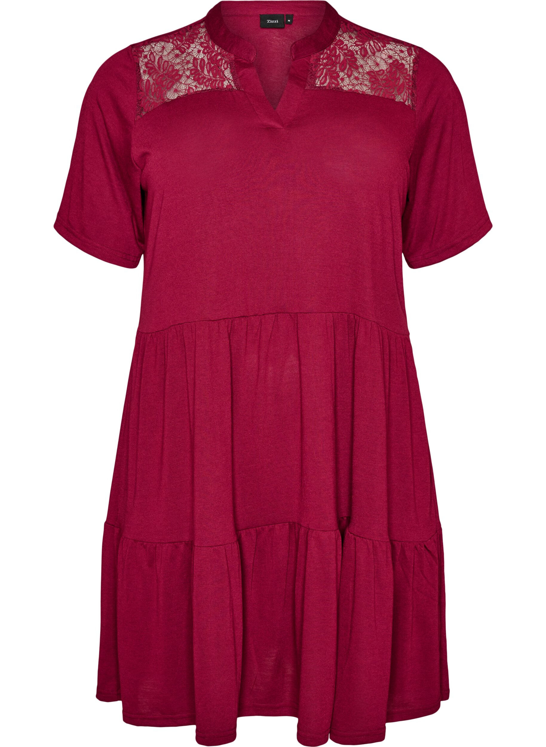 Jerseyjurk met kanten details en een gelaagde rok